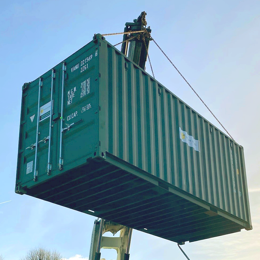 Crane lifting shipping container