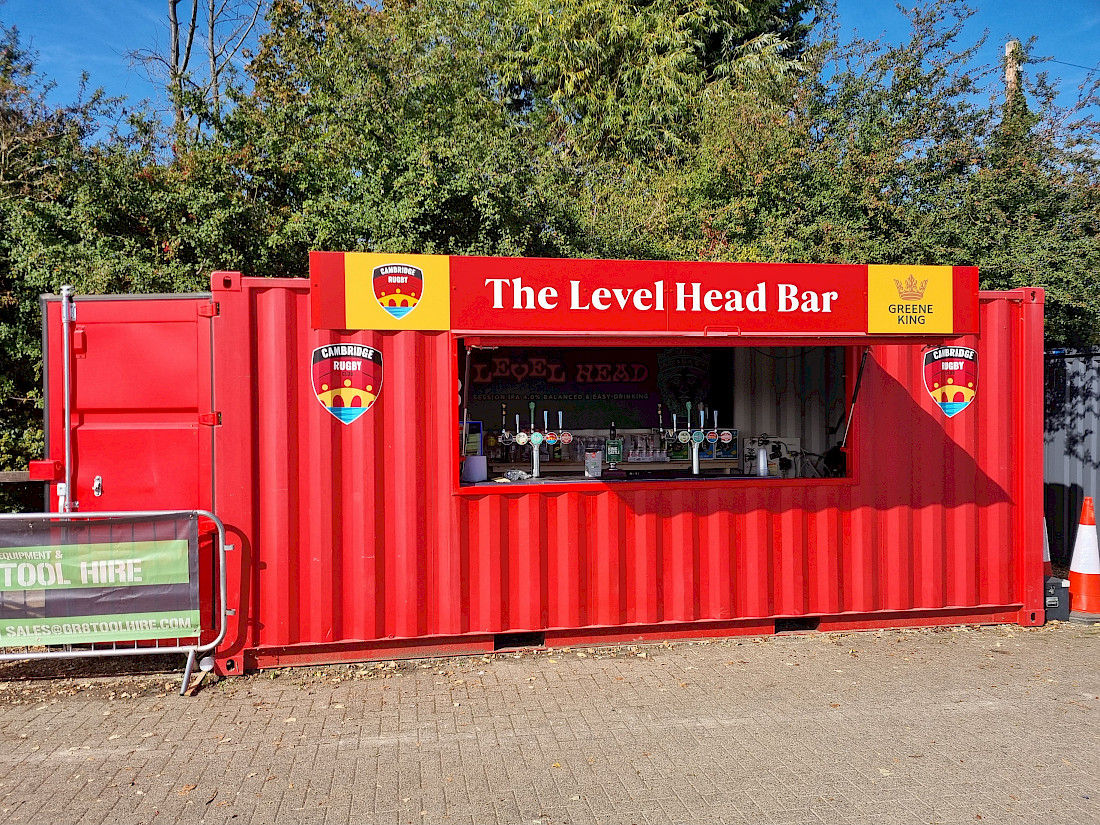 Shipping container pitch side bar at Cambridge rugby club